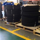 What are the components of a hydraulic hose assembly?